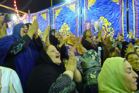 Egyptian women cheer at a political rally