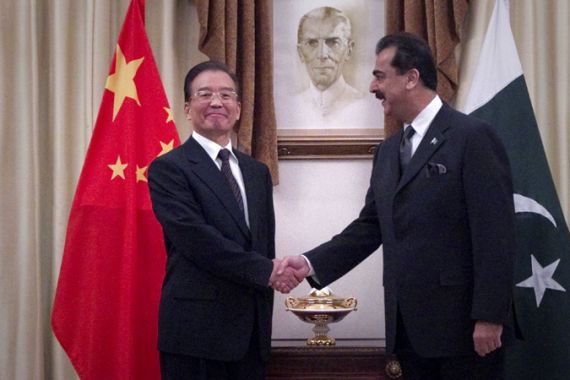 Pakistan''s Prime Minister Gilan shakes hands with his Chinese counterpart