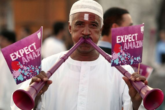 Doha, -, QATAR : A Qatari man blows vuvuzela trumpets at Doha''s traditional souk as people gather to follow FIFA''s decision on who will host the 2022 World Cup on December 2, 2010. Qatar is bidding to host the event along with Japan, South Korea, Australia and the United States. AFP PHOTO/MARWAN NAAMANI