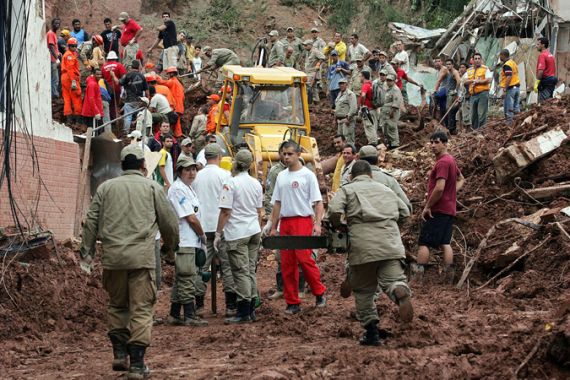 rescuers at scene of landslide