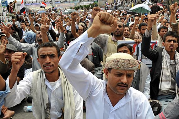 Yemeni anti-government protesters shout slogans during a demonstration demanding the ousting of Yemeni President Ali Abdullah Saleh, in Sanaa
