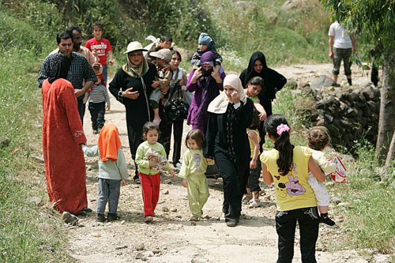 Syrian women and children arrive in Wadi Khaled in northern Lebanon, near the Lebanese-Syrian border