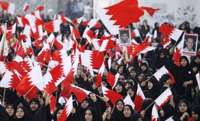 Bahraini women wave flags