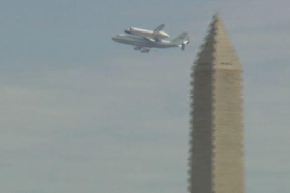 Shuttle Discovery over Washington Monument