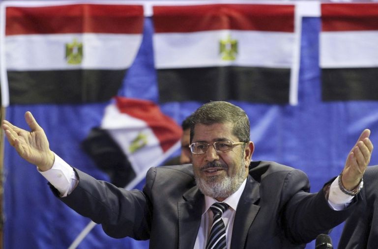 Mursi, the Brotherhood''s presidential candidate, welcomes his supporters during a campaigning conference in Old Cairo
