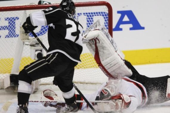 Devils goalie Brodeur makes a save on Kings'' Lewis during Game 4 of the NHL Stanley Cup hockey finals in Los Angeles