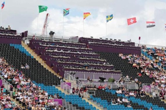 Empty seats reserved for VIPs and athletes are seen at the Eventing Individual Dressage at the London 2012 Olympic Games in Greenwich Park