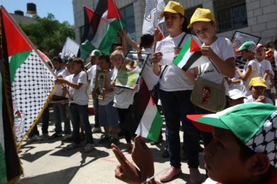 Dozens of Palestinian children protest i
