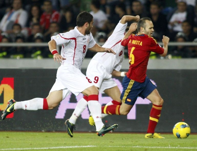 Georgia''s Murtaz Daushvili and David Targamadze chase Spain''s Andres Iniesta during their 2014 World Cup qualifying soccer match at Boris Paichadze Stadium in Tbilisi