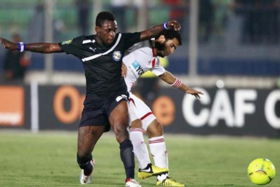 Egypt''s Zamalek Gaber (R) fights for the ball with Clottey of Ghana''s Berekum Chelsea during their CAF Champions League soccer match in Cairo