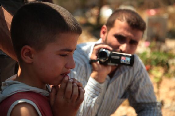 Filing at FSA media centre [Richard Hall/Al Jazeera]