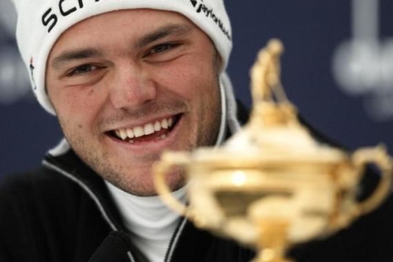 Germany''s Kaymer laughs as he sits next to Ryder Cup during news conference at Dunhill Links Championship in the Old Course in St Andrews