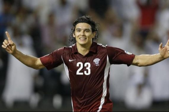 Qatar''s Sebastian Soria celebrates after scoring a goal against Lebanon during their 2014 World Cup qualifying soccer match in in Doha