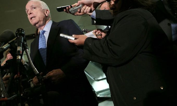 John McCain speaks to reporters