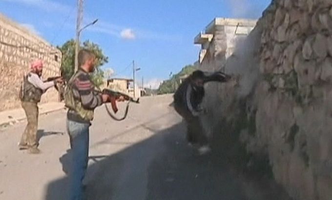Syrian rebels appear to shoot prisoner dead - still from TV package