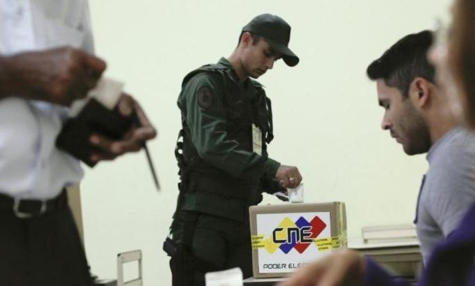 Soldier casts his vote during regional elections in Caracas
