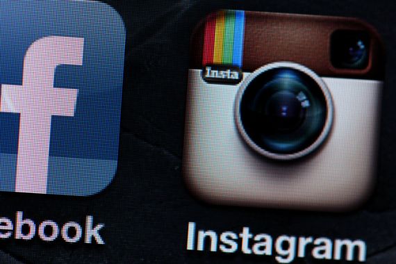 A file picture dated 09 April 2012 shows the logos of the Facebook (L) and Instagram (C) apps pictured on an IPhone in Cologne, Germany.