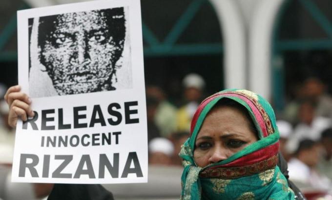 File photo of a demonstrator holding an image of Nafeek, jailed in Saudi Arabia on charges of murder, during a protest demanding her release in Colombo