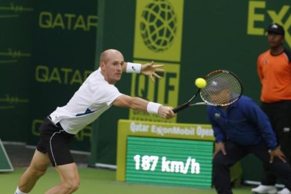 Russia''s Davydenko hits a return to his compatriot Youzhny during the Qatar Open men''s singles tennis match in Doha