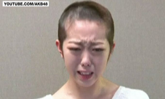 Japan pop star remorse shaved head