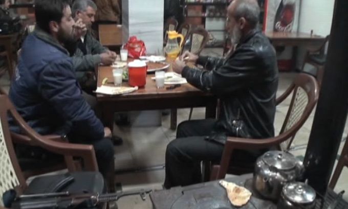Syria restaurant soldiers on