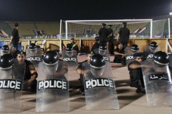 Riot police keep watch during CAF soccer match against between Egypt''s Zamalek and Ghana''s Berekum Chelsea in Cairo