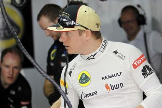 Lotus Formula One driver Raikkonen stands in the garage during the first practice session of the Bahrain F1 Grand Prix at the Sakhir circuit