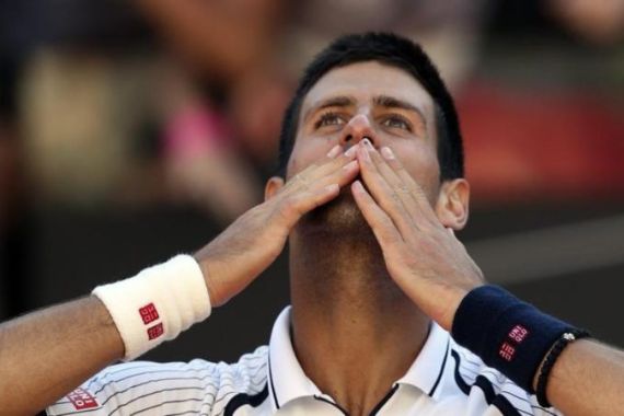 Djokovic of Serbia celebrates after defeating Montanes of Spain during their men''s singles match at the Rome Masters tennis tournament