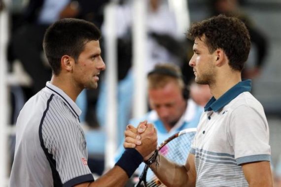 Novak Djokovic of Serbia congratulates Grigor Dimitrov of Bulgaria on his victory at the end of their men''s singles match at the Madrid Open tennis tournament