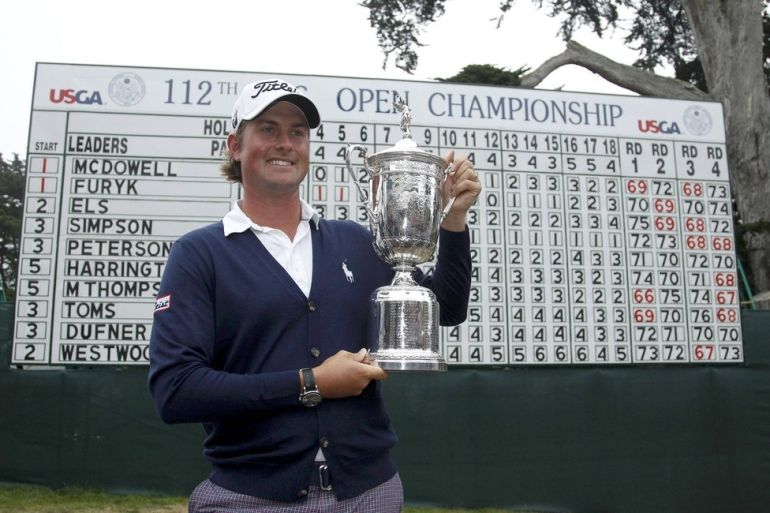Webb Simpson of the U.S. holds the U.S. Open Championship Trophy after he won the 2012 U.S. Open golf championship on the Lake Course at the Olympic Club in San Francisco