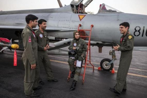 Ayesha Farooq, 26, Pakistan''s only female war-ready fighter pilot, chats with her colleagues beside a Chinese-made F-7PG fighter jet at Mushaf base in Sargodha