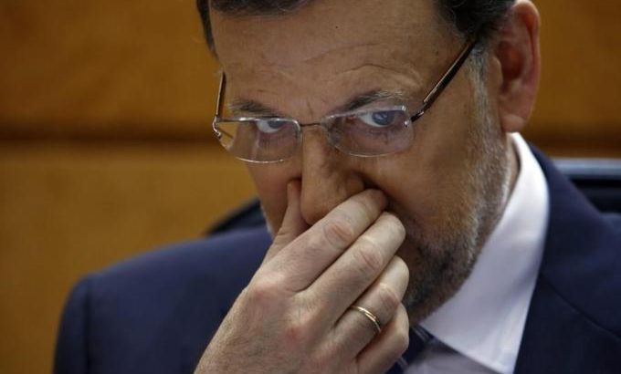 Spanish PM Rajoy gestures as Spanish opposition leader Perez Rubalcaba (not pictured) speaks during a session at Madrid''s Senate