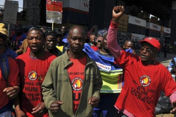 Members of the National Union of Mine take part in a strike in Johannesburg
