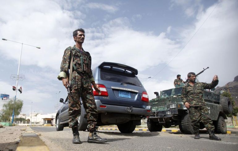 Police troopers man a checkpoint near the British embassy in Sanaa