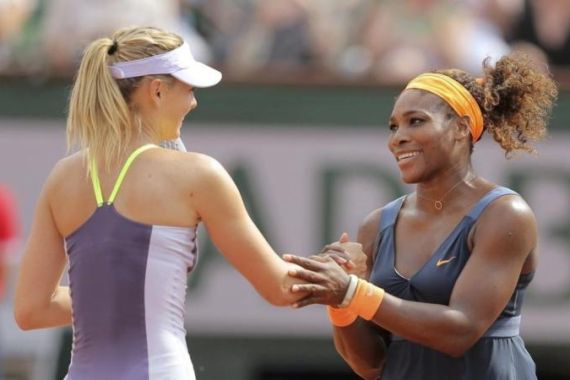 Williams of the U.S. shakes hands with Sharapova of Russia after winning the French Open tennis tournament in Paris