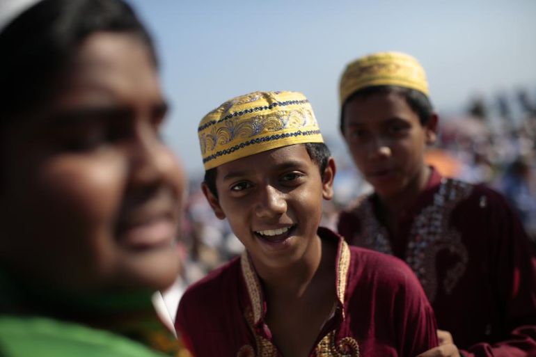 Boys smile at end of prayers for the Muslim Eid al-Fitr holiday, which marks the end of the fasting month of Ramadan, in the southern Italian city of Palermo