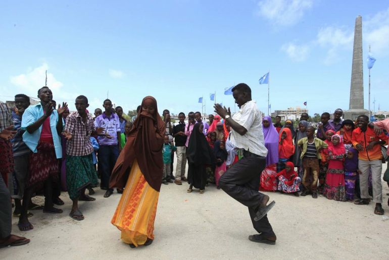 Somali residents dance to tradition tunes while celebrating the Muslim Eid al-Fitr holiday, which marks the end of the fasting month of Ramadan, north of capital Mogadishu