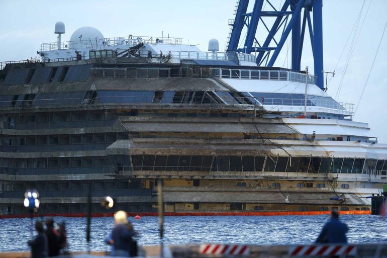 The capsized cruise liner Costa Concordia is seen at the end of the "parbuckling" operation outside Giglio harbour