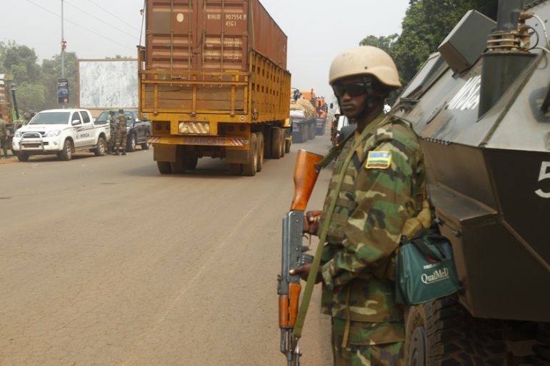 Peacekeeping troops escort a humanitarian aid convoy in Bangui,