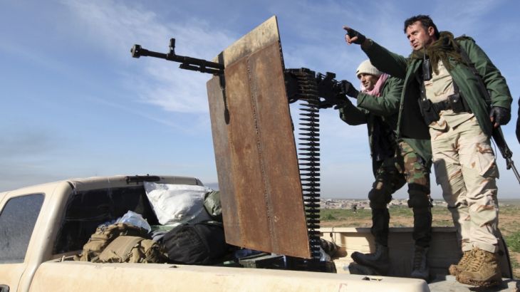 Kurdish Peshmerga fighters battle ISIL near Mosul