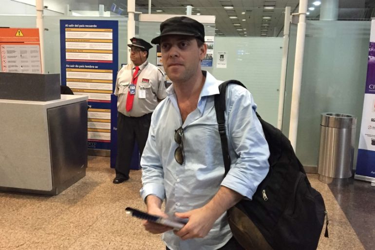Argentine journalist Damian Pachter, who works for the Buenos Aires Herald newspaper, waits before taking a flight out of the country at Buenos Aires'' airport