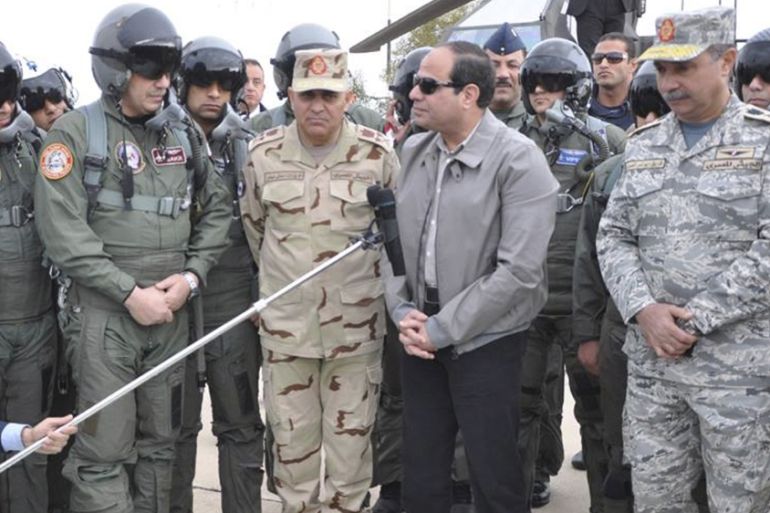 Egyptian President Abdel Fattah al-Sisi speaks during a meeting with pilots and crews specialists of the Egyptian Air Force near the border between Egypt and Libya