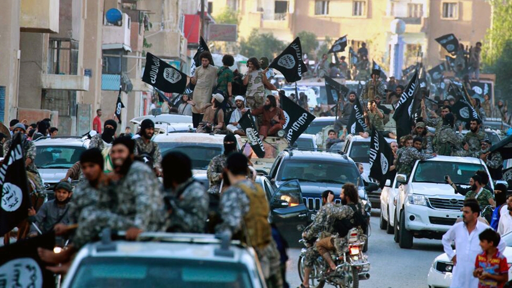 Fighters from the Islamic State of Iraq and Levant parade in Raqqa, north Syria. [AP/Raqqa Media Center of the Islamic State group]