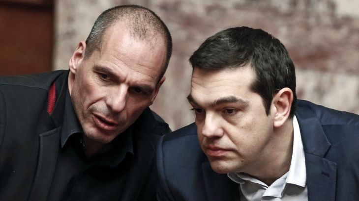 Greek PM Tsipras and Finance Minister Varoufakis talk during the first round of a presidential vote at the Greek parliament in Athens