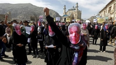 Afghans wear masks in a protest to condemn the killing of Farkhunda [REUTERS]
