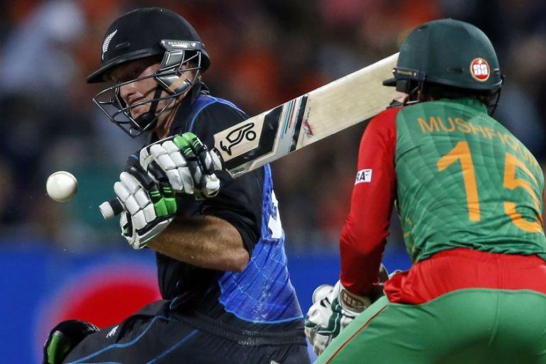 New Zealand''s Guptill hits a pull shot while making a century watched by Bangladesh''s Rahim during their Cricket World Cup match in Hamilton