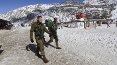 Israeli soldiers at the intersection of the Israeli-Lebanese-Syrian border in the Golan Heights [EPA]