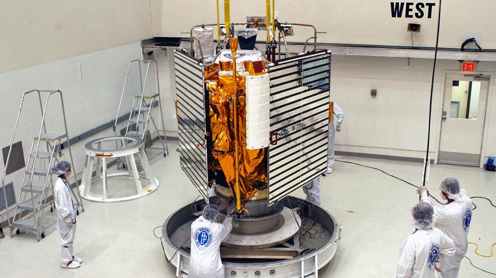 Technicians from the Johns Hopkins University prepare the Messenger spacecraft [NASA via AP]