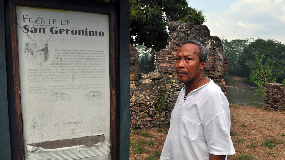 Ivan Lay stands at the crumbling remnants of a fort built by the Spanish in 1762 [Joe Jackson/Al Jazeera]