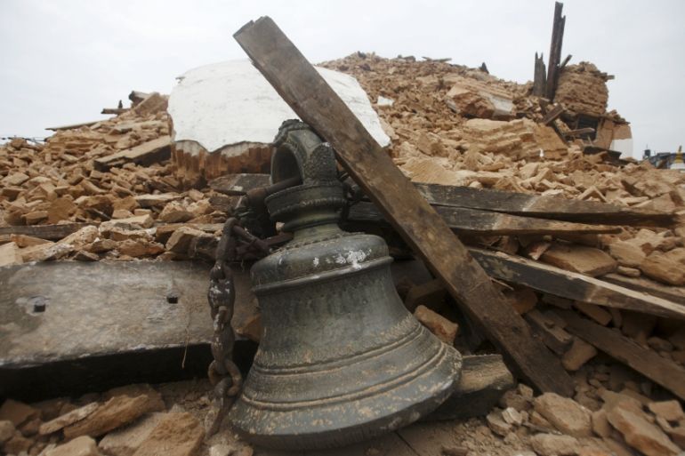 Bell of a temple lies in the debris of the collapsed temple after an earthquake, in Kathmandu
